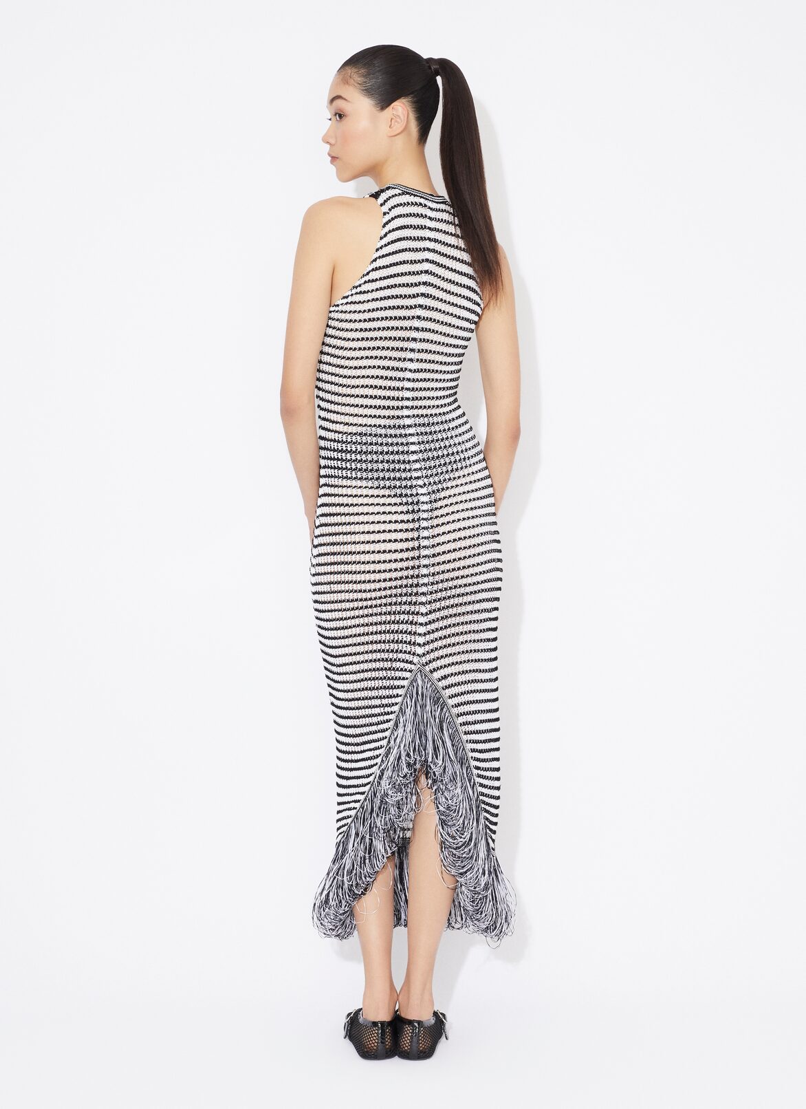 ABITO ALL'UNCINETTO CON FRANGE BODY CONSCIOUS  ALAÏA ABITO ALL'UNCINETTO CON FRANGE BODY CONSCIOUS  BIANCO/NERO